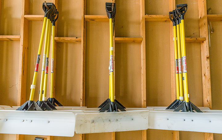 Snow shovels hanging on the wall