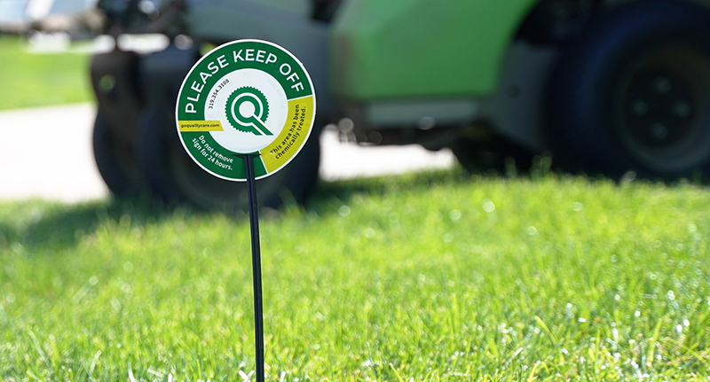 Quality Care lawn application sign