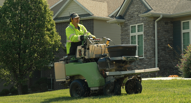 guy seeding a lawn